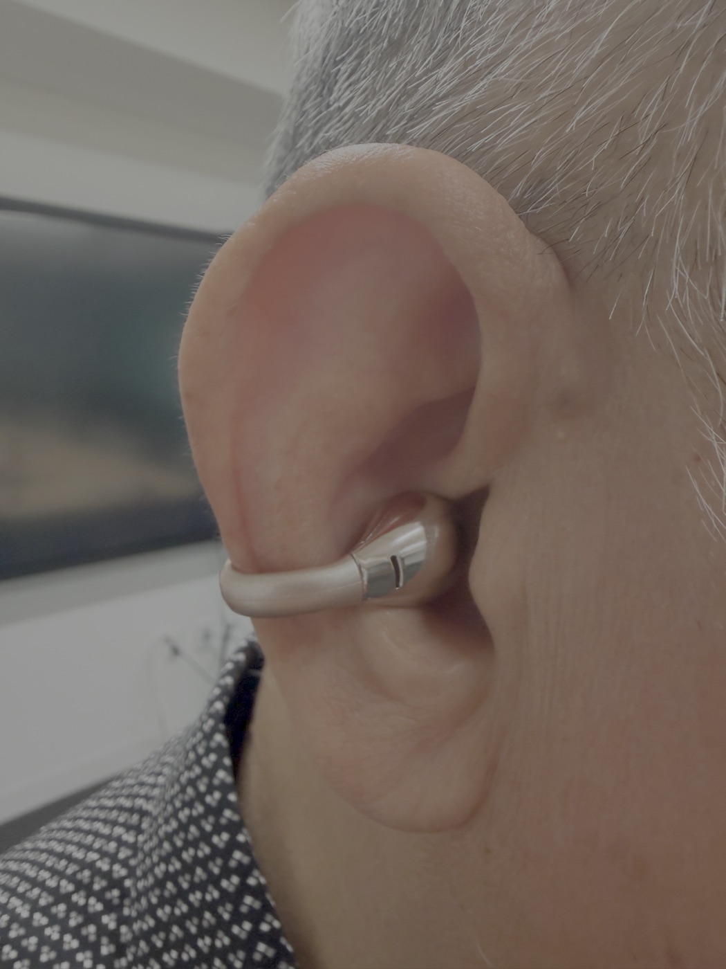 HiJavis open-ear earphone worn on the ear